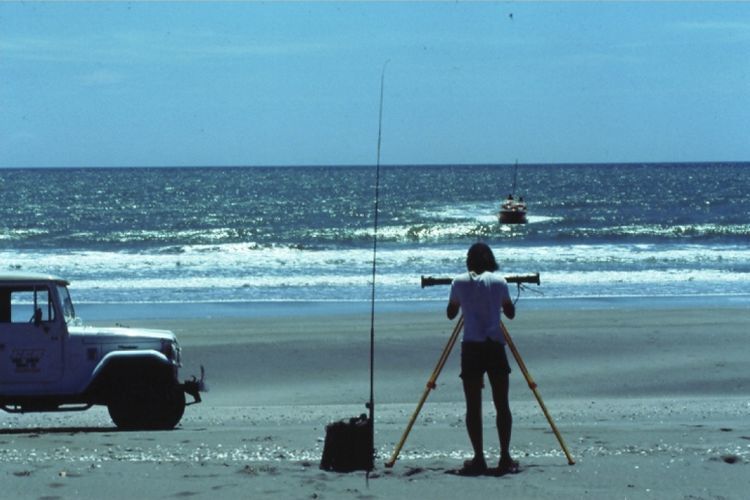 Scientists undertaking a beach profile survey in 1970s, NZ