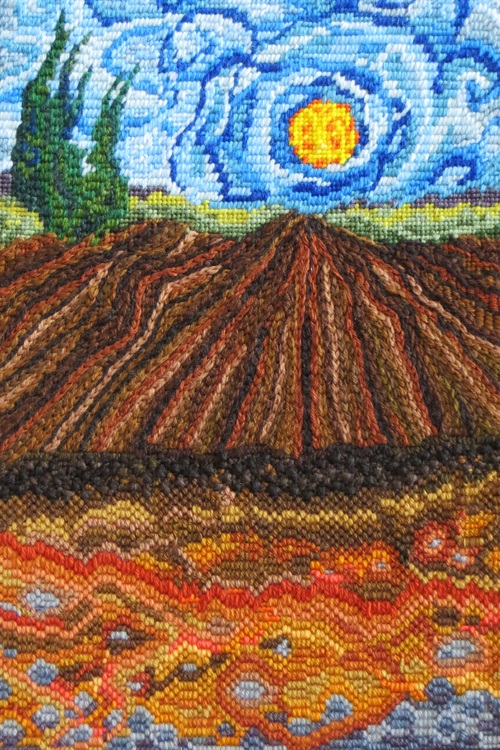 Tapestry work portraying soil and field and sky.