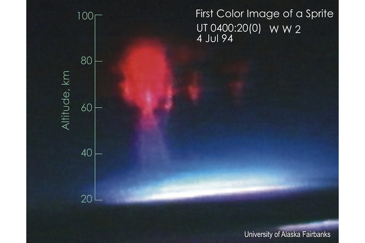 Red sprite photo - high above the top of a thunderstorm cloud