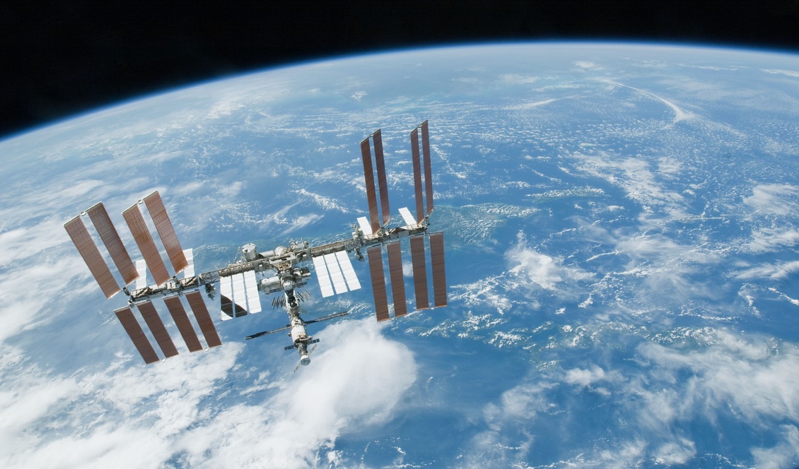 International Space Station with the Earth behind it. 