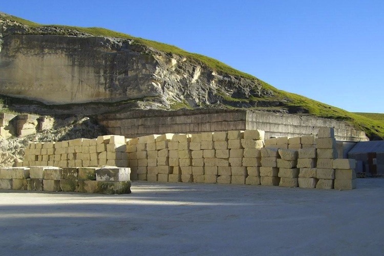 Cut blocks of raw limestone ready for processing at the quarry