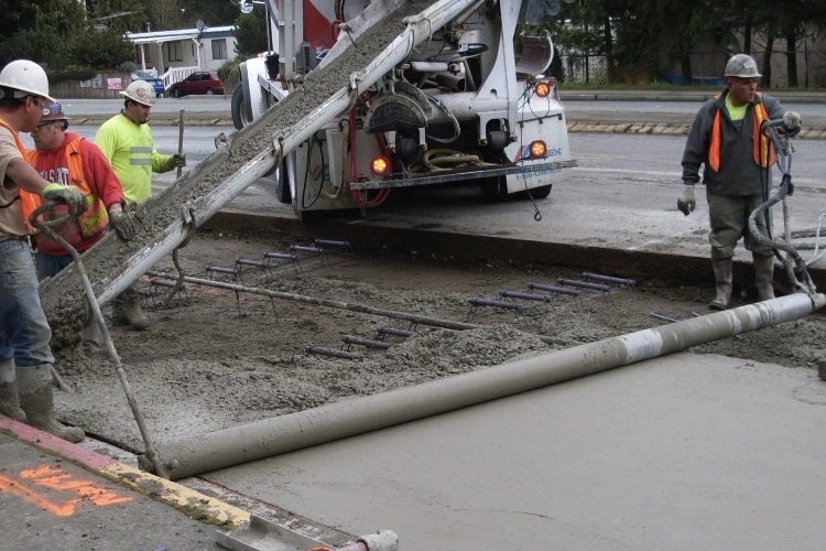 Workers laying concrete