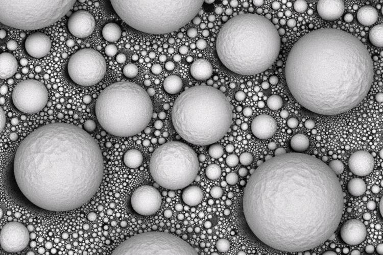 SEM microscope image of tin spheres of various sizes.