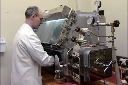 Dr Richard Tilley works with silicon inside a sealed ‘glove box’