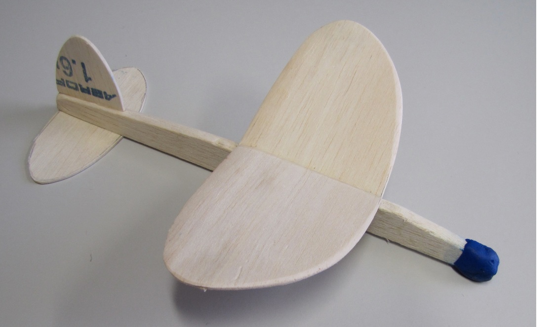 A model glider made from balsa wood.