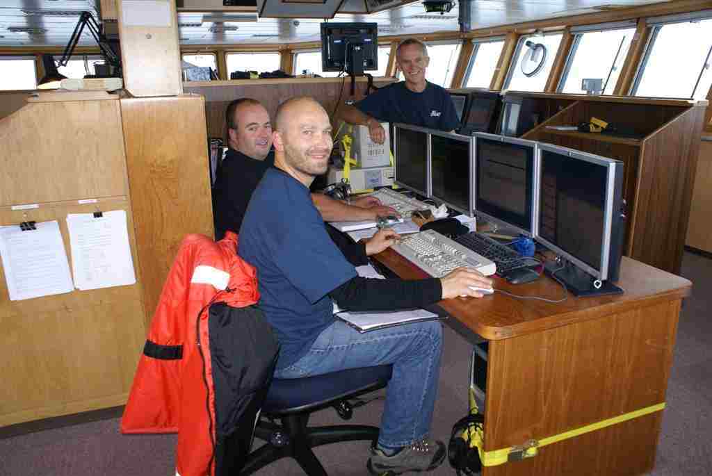 The IT and multibeam team on board the research ship Tangaroa.