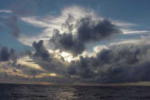 Image of Towering cumulus clouds over the sea.