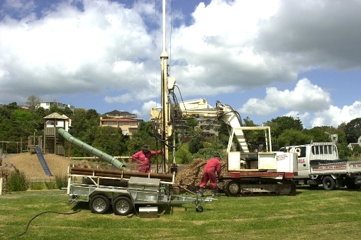 Removing a rock core sample from Onepoto Basin, New Zealand