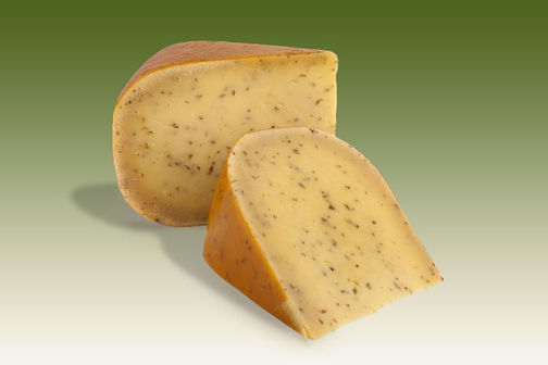 Two large slices of traditional cumin flavoured gouda.