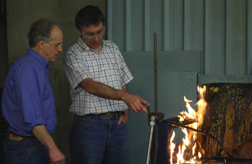 Dr Mike Spearpoint and Dr Charley Fleischmann with burning sofa