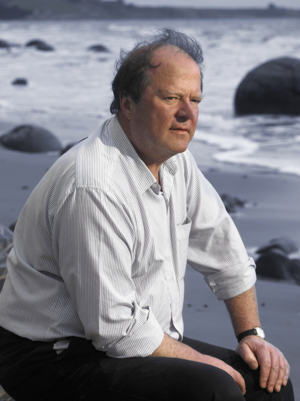 Prof Keith Hunter sitting on a beach