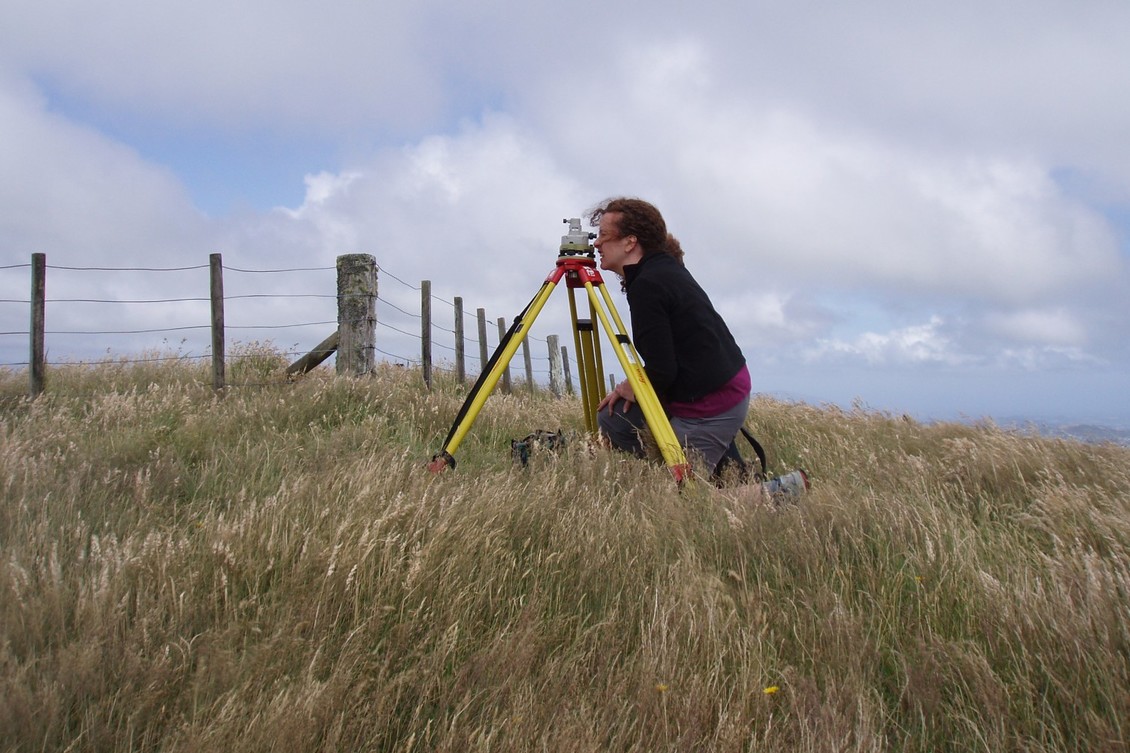 Dr Laura Wallace sets up a GPS site on the Kapiti Coast, NZ.
