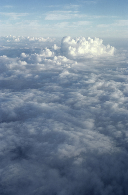 View from high looking down of clouds in the sky.