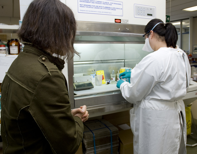 Pathologist overseeing sample being prepared for cancer diagnosi