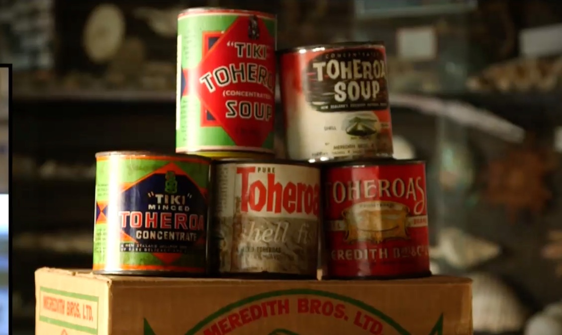 Five old cans of toheroa shellfish.
