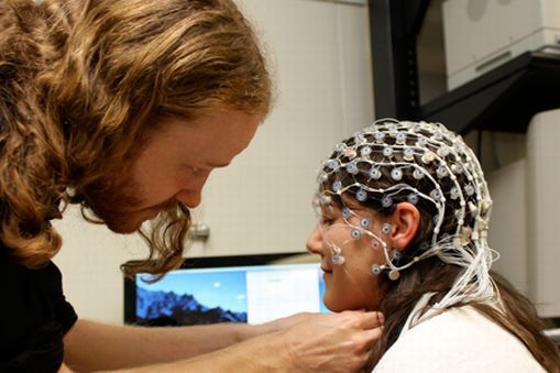Dr Damian Cruse demonstrates using electroencephalography (EEG)