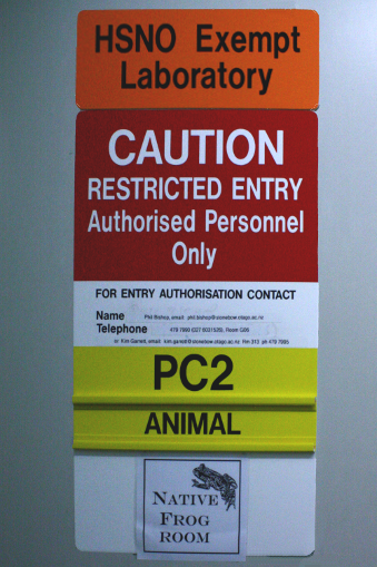 Various warning signs by Native frog captivity room