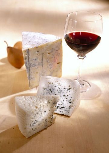 Blue cheese and a glass of red wine. 