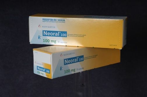 Two packs of Neoral® Cyclosporine - an immunosuppressive drug.