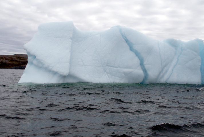 Large Iceberg floating in the sea. 