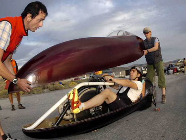 Sam Whittingham in a racing recumbent bicycle 2009 and helpers