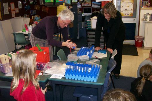 Teachers preparing an experiment in her classroom