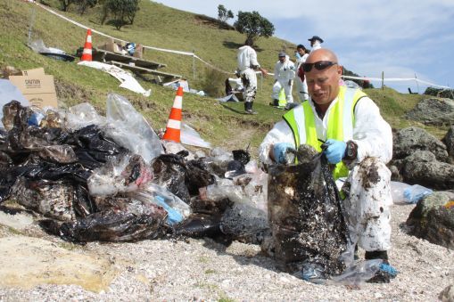 Volunteers cleaning Bay of Plenty beaches after Rena oil spill.