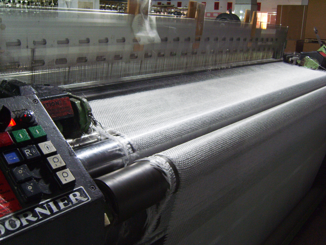 Weaving glass fabric machine.