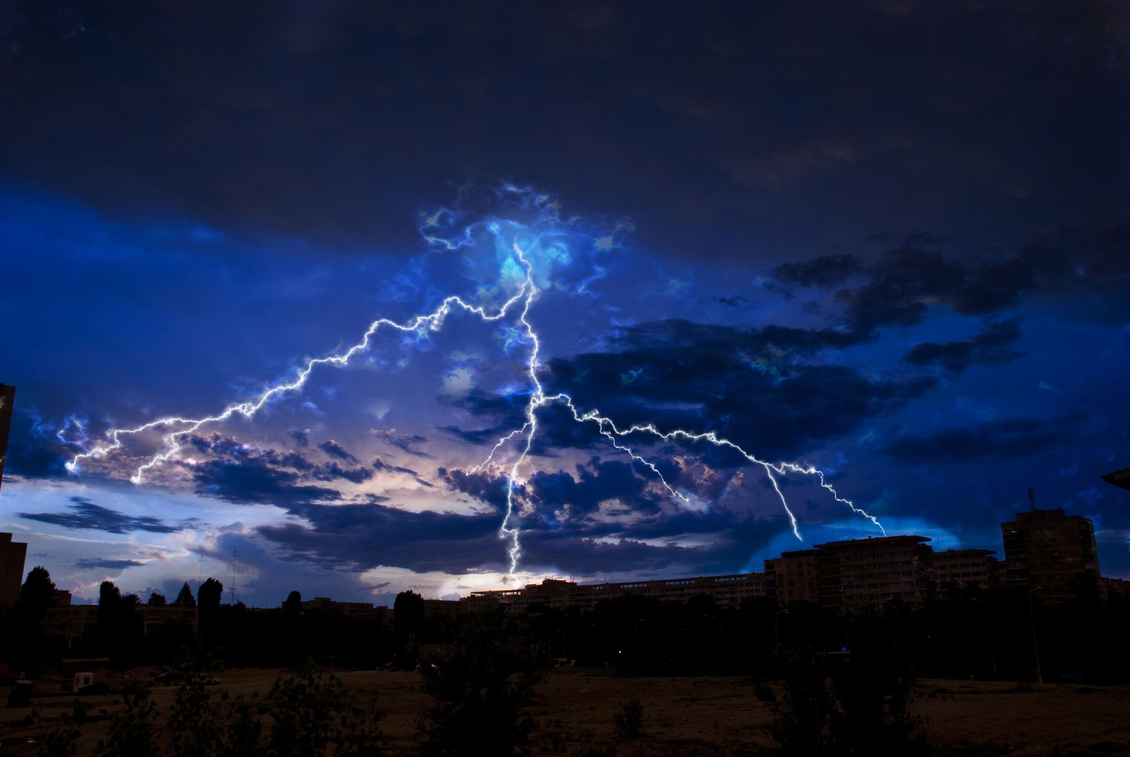  Image showing jagged forks of lightning during a storm.