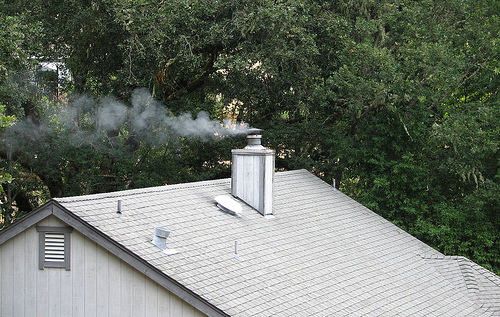 Rook and smoking chimney