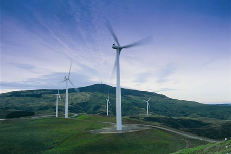 Wind turbines on top of hills in New Zealand.