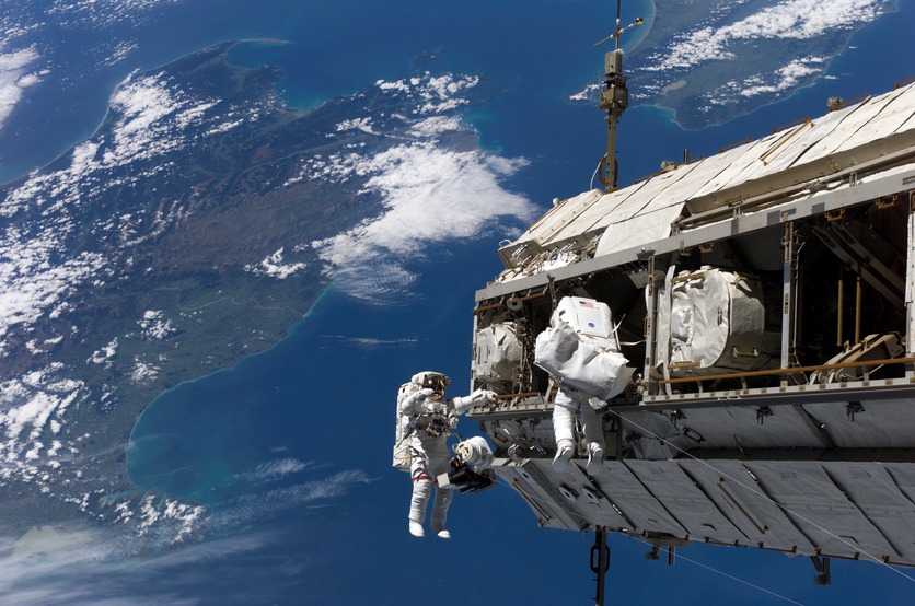 Astronauts working externally on International Space Station