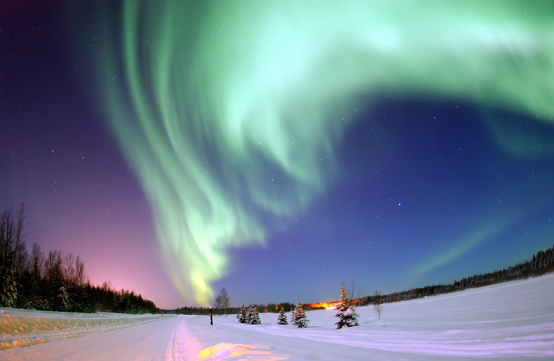 Aurora borealis, or northern lights, above Bear Lake, Alaska.