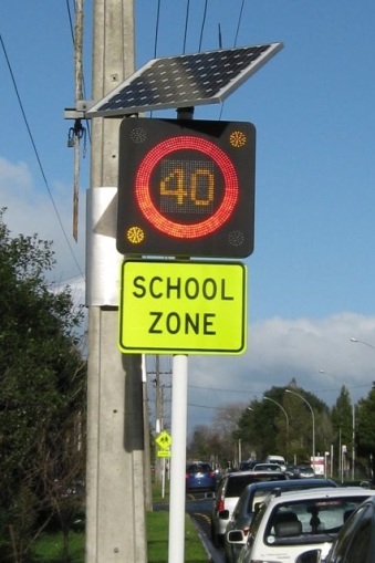 New Zealand school zone road sign powered by solar energy.