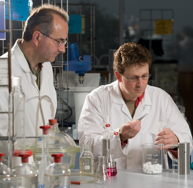 2 male scientists working on samples of bovine hydroxyapatite