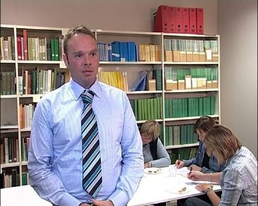 Sam Heenan, a student at Otago University, in office with others