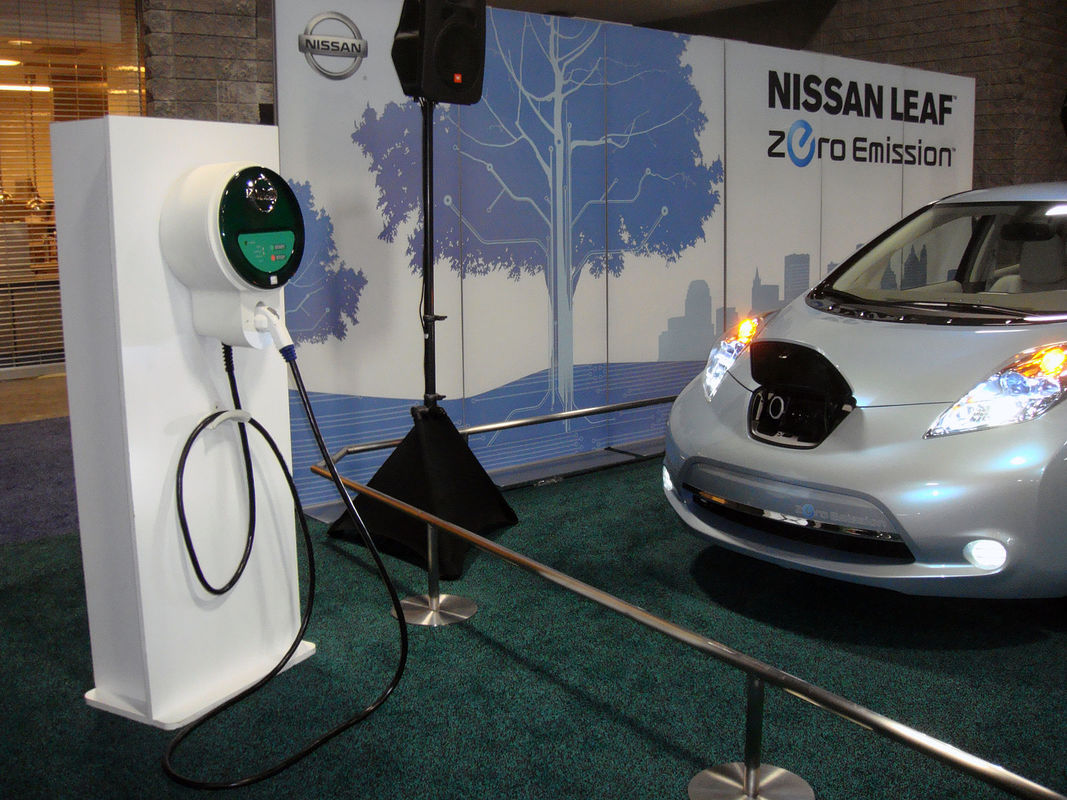 Nissan Leaf all-electric vehicle and charge in a showroom