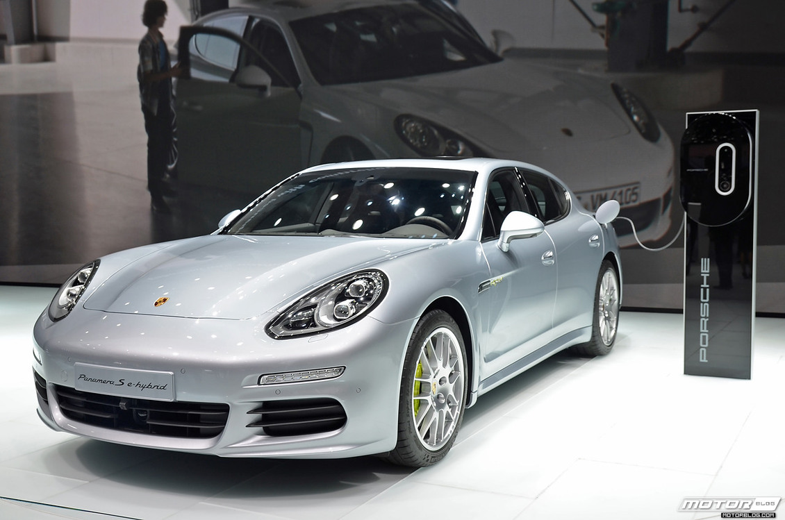Porsche Panamera S E-Hybrid charging in a showroom.