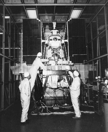 3 people working around the Nimbus-3 satellite 1969/