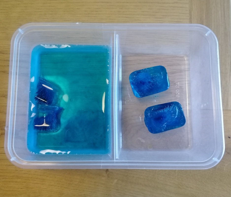 Modelling glacial ice melt with ice cubes and water.
