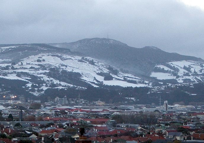 Mount Cargill lightly covered with snow, Dunedin in foreground.