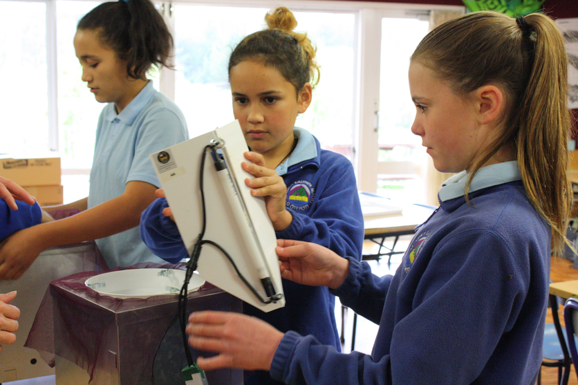 Students with Heath trap, a portable light for collecting moths
