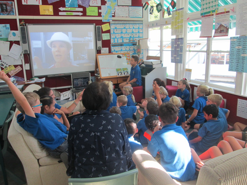 Students in classroom have a Zoom meeting with scientist