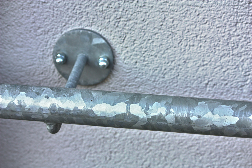 Hot-dip galvanizing (zinc coating) on a steel handrail