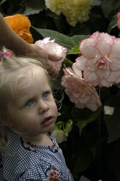 Young girl by flowers