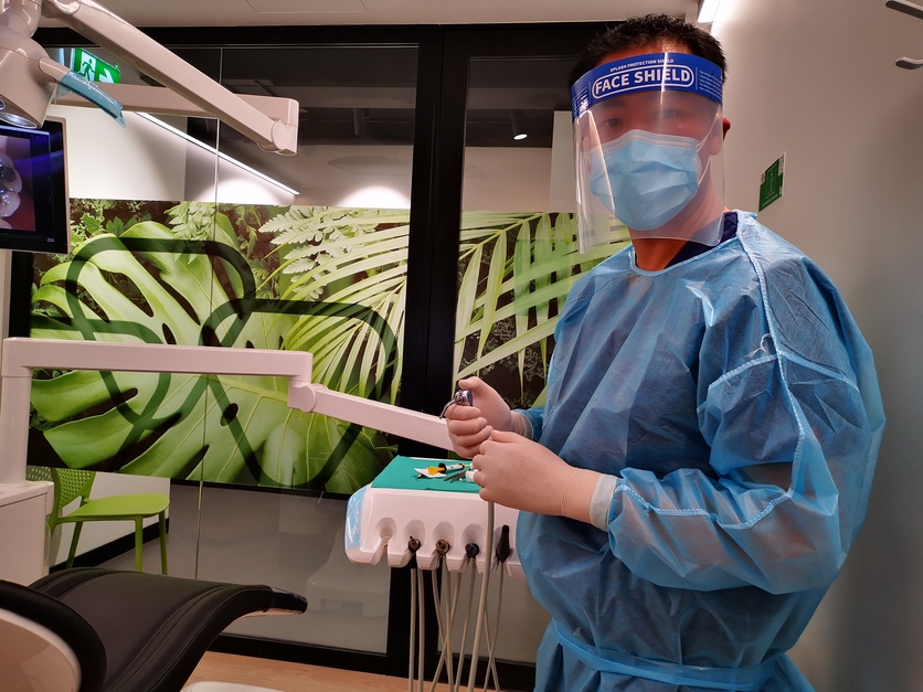 Dentist wearing PPE during the COVID-19 pandemic in 2020. 