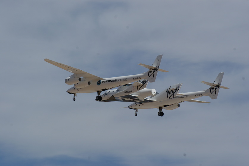 SpaceShipTwo a winged plane with a single rocket motor flying