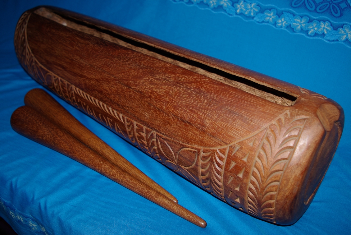 Samoan Ironwood slit drum and two drum sticks, made in Samoa. 