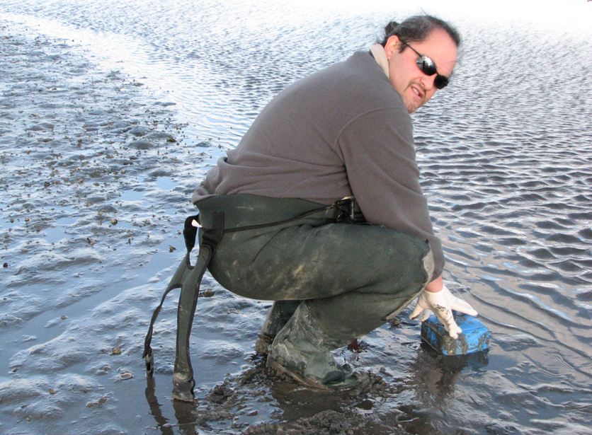 Dr James Ataria collects samples from the Ahuriri Estuary