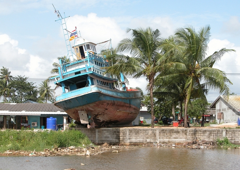 Fishing boat in a village after tsunami that hit Phuket Island